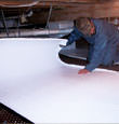 Cloquet insulation being installed in a crawl space.