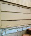 an old-fashioned crawl space door in Chisholm about to be replaced