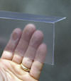 Closeup of a clear plastic covering on a Mora crawl space block wall