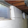A foundation showing severe inward buckling along the windows in a Two Harbors home.
