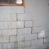 A cracked foundation wall near a window in a Pierz home