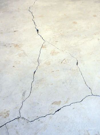 severely cracked, heaving slab floors in a home in Pequot Lakes