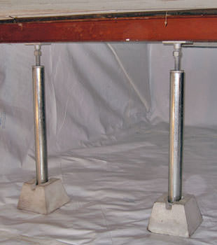 Crawl space jack posts installed in conjunction with a crawl space vapor barrier in Rush City