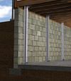 I-beam foundation wall supports installed in a Hinckley basement.