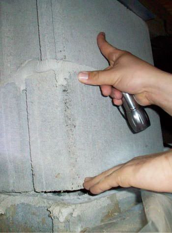 a completely failing concrete crawl space support pillar in Nisswa