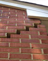 Serious damage to a foundation wall due to settlement of a home in Ely