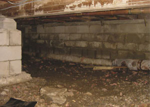 Rotting, decaying crawl space wood damaged over time in Pequot Lakes