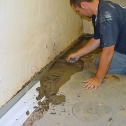 Testing a French drain system in a Mora home.