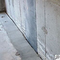 an ugly basement weeping tile drainage system that's clogged and not working in Grand Rapids.
