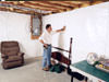 A basement wall covering for creating a vapor barrier on basement walls in Aitkin