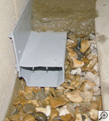 A no-clog basement french drain system installed in Rice Lake
