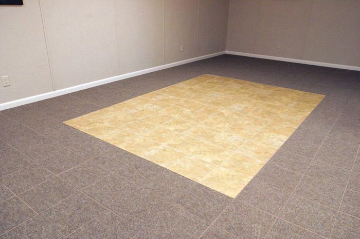 tiled and carpeted basement flooring installed in a Brainerd home