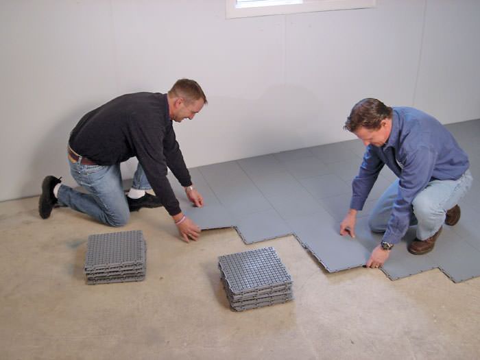 Bat Sub Floor Matting Options In Minnesota And Wisconsin Contractors Installing Bat Subfloor Tileatting On A Concrete Floor In Hibbing Minnesota