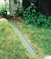 A recessed gutter drain extension installed in Nisswa, Minnesota and Wisconsin