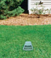 A buried gutter drain downspout extension installed in a Nisswa home