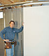 Installing wall panels on top of our basement wall insulation in Cloquet